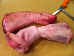 Pig's skin trimmed and peeled away from the hock